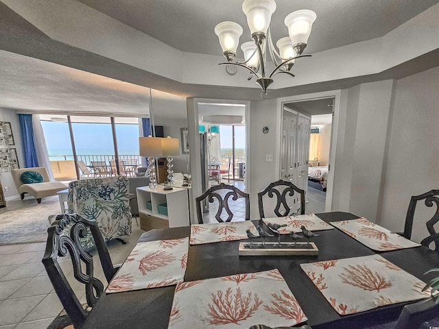 9650 Shore Dr Unit 1203, Myrtle Beach, SC 29572 - dining area featuring a chandelier, healthy amount of natural light, and a textured ceiling
