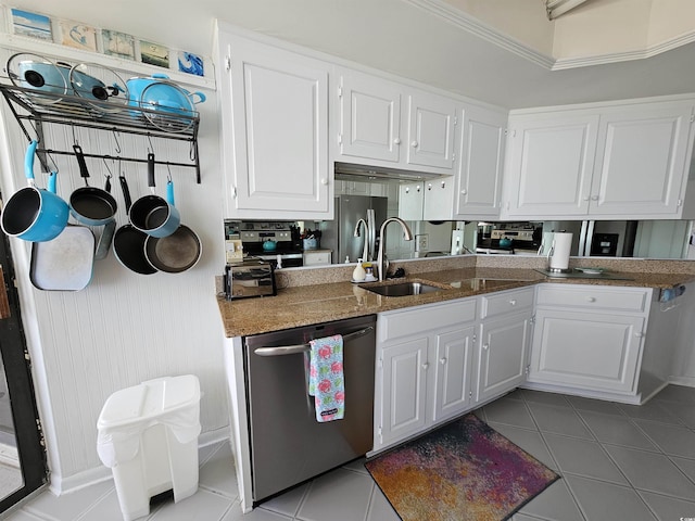 9650 Shore Dr Unit 1203, Myrtle Beach, SC 29572 - kitchen featuring appliances with stainless steel finishes, a sink, white cabinets, and light tile patterned floors