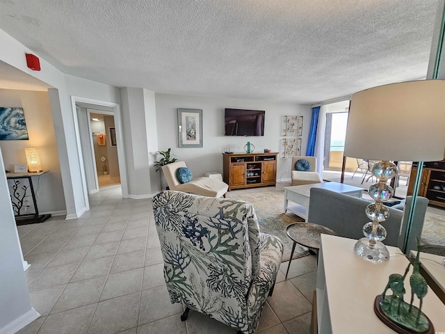 9650 Shore Dr Unit 1203, Myrtle Beach, SC 29572 - living area featuring baseboards, a textured ceiling, and light tile patterned floors