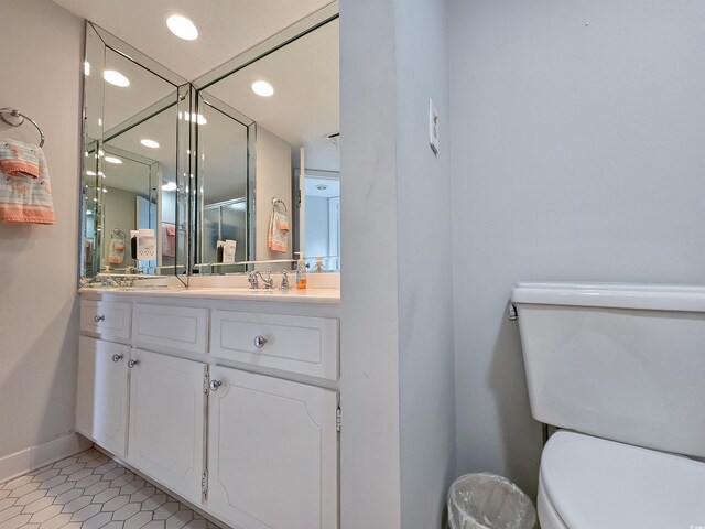 9650 Shore Dr Unit 1203, Myrtle Beach, SC 29572 - full bathroom with baseboards, toilet, vanity, a shower stall, and recessed lighting