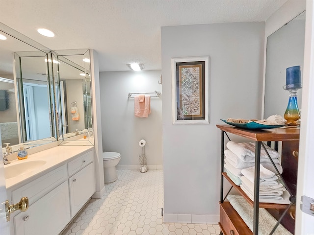 9650 Shore Dr Unit 1203, Myrtle Beach, SC 29572 - bathroom with toilet, vanity, baseboards, recessed lighting, and a shower