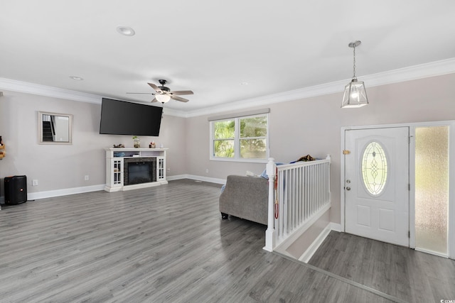 1720 Horry St, Conway, SC 29526 - entrance foyer featuring ceiling fan, ornamental molding, light wood-type flooring, baseboards, and a fireplace