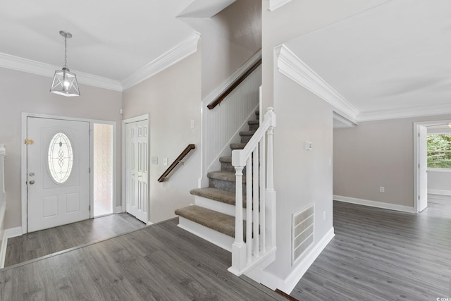1720 Horry St, Conway, SC 29526 - entrance foyer featuring ornamental molding, wood finished floors, stairway, and baseboards