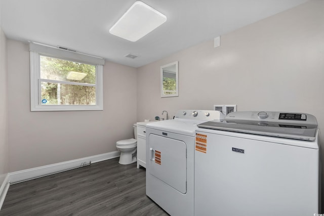 1720 Horry St, Conway, SC 29526 - laundry area featuring independent washer and dryer, baseboards, plenty of natural light, and dark wood-style flooring