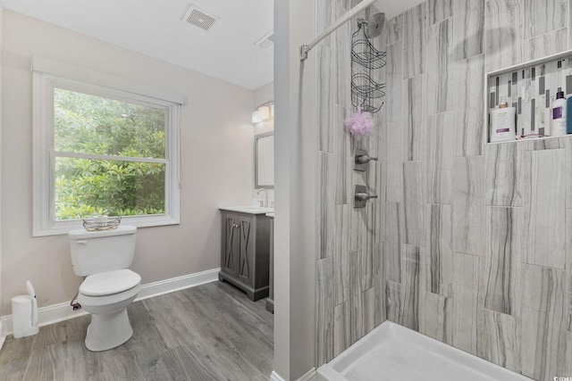 1720 Horry St, Conway, SC 29526 - bathroom with toilet, a tile shower, wood finished floors, and vanity