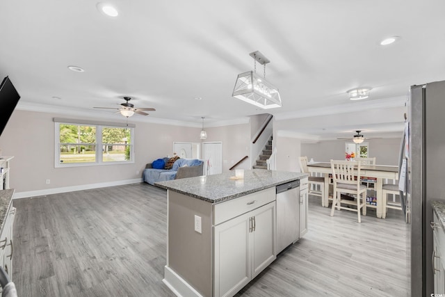 1720 Horry St, Conway, SC 29526 - kitchen featuring appliances with stainless steel finishes, ceiling fan, ornamental molding, light wood-style flooring, and a kitchen island