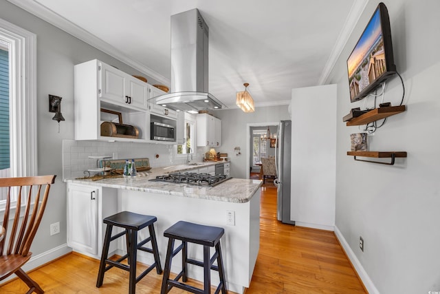 kitchen featuring open shelves, island exhaust hood, stainless steel appliances, a peninsula, and white cabinetry