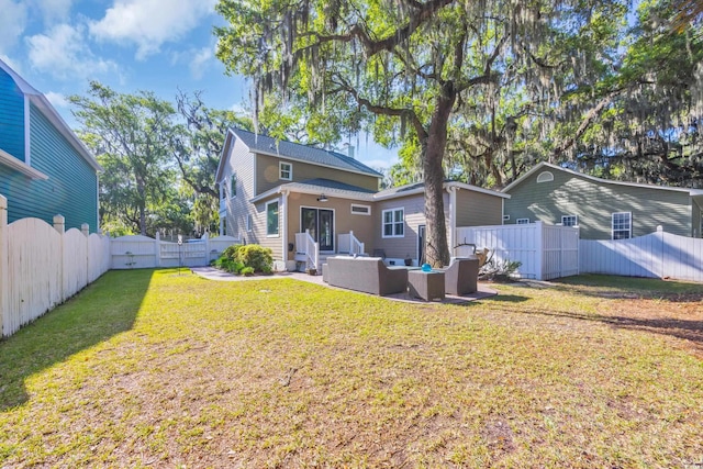 back of property with an outdoor hangout area and a patio