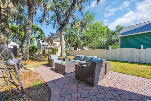 view of patio with an outdoor living space, a fenced backyard, and central AC