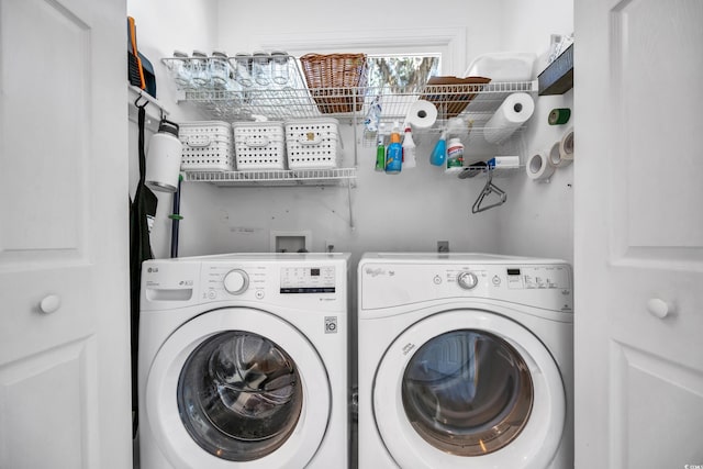 laundry room with washing machine and dryer