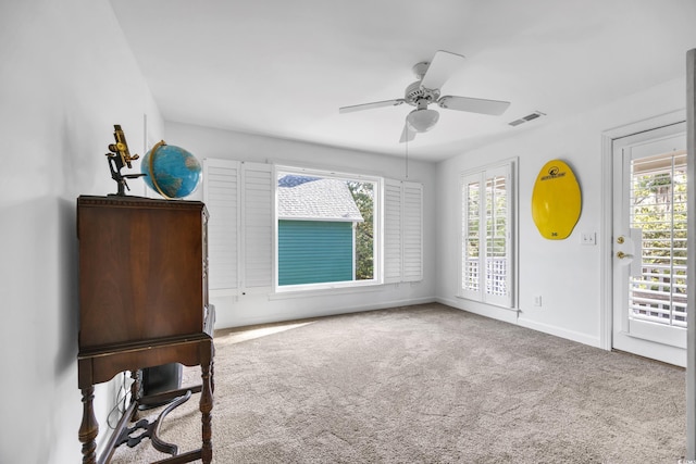 unfurnished bedroom with carpet, baseboards, a ceiling fan, and access to outside