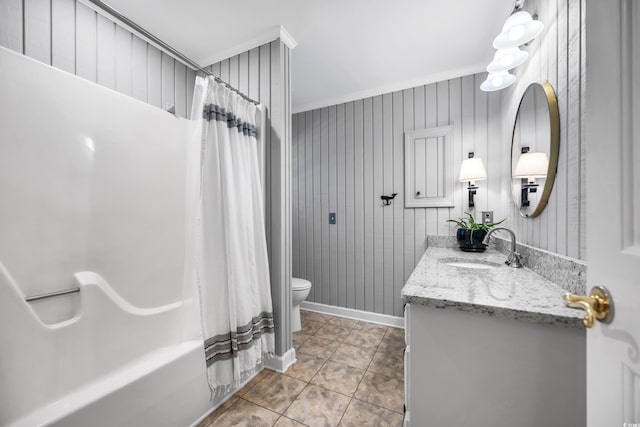 full bathroom with crown molding, toilet, vanity, tile patterned floors, and shower / tub combo with curtain