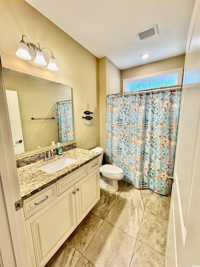 full bathroom with toilet, vanity, and a shower with shower curtain