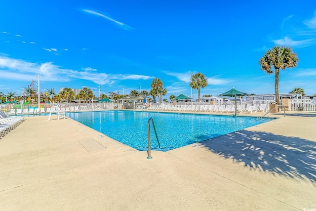 6001-8026 S Kings Hwy, Myrtle Beach, SC 29575 - community pool featuring fence and a patio area