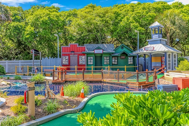 6001-8026 S Kings Hwy, Myrtle Beach, SC 29575 - view of swimming pool with a putting green and view of wooded area