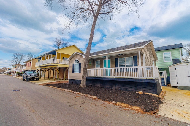 6001-8026 S Kings Hwy, Myrtle Beach, SC 29575 - view of front of property featuring covered porch, a storage shed, central AC unit, and an outdoor structure