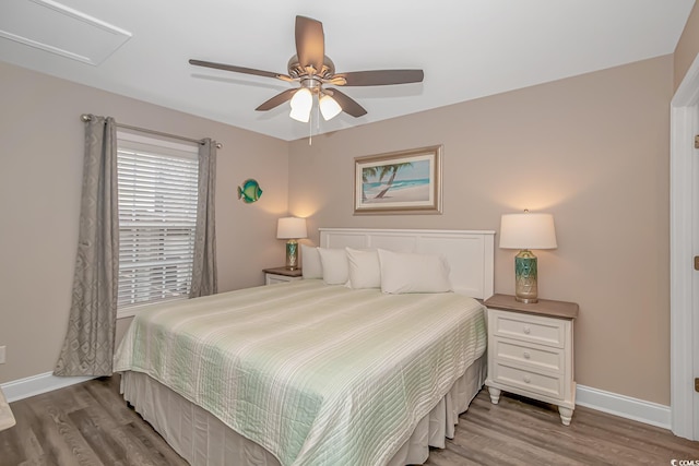 6001-8026 S Kings Hwy, Myrtle Beach, SC 29575 - bedroom with baseboards, wood finished floors, and ceiling fan