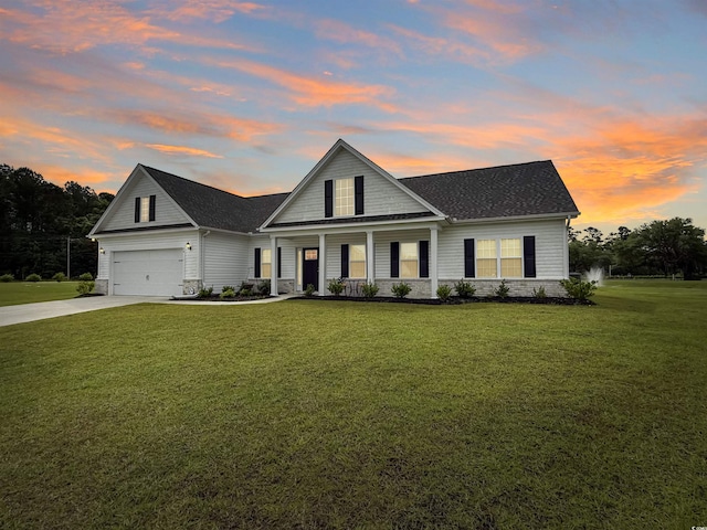 view of front of property with covered porch, a front lawn, driveway, a shingled roof, and a garage