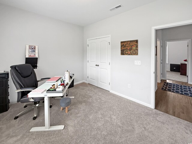 office space with carpet flooring and baseboards