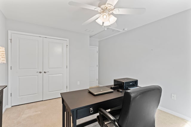 office area featuring light carpet, ceiling fan, baseboards, and attic access