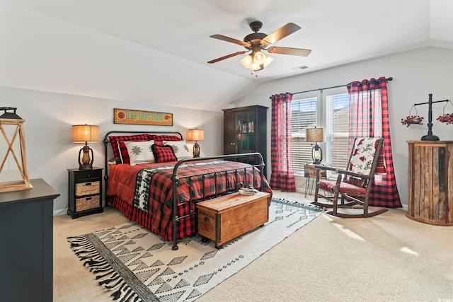 bedroom featuring lofted ceiling, carpet floors, and ceiling fan