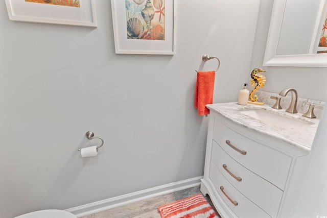 bathroom featuring vanity and baseboards
