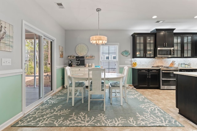 dining space featuring a chandelier