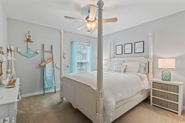carpeted bedroom featuring ceiling fan and baseboards