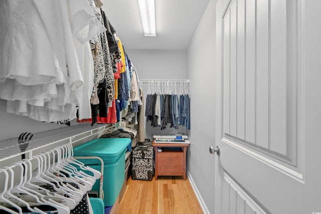 walk in closet featuring light wood-style flooring