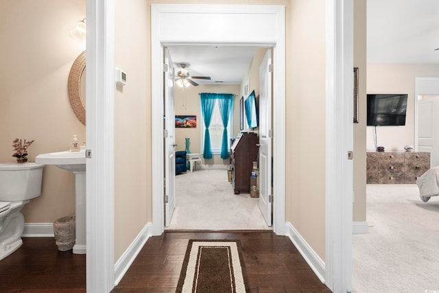 1681 Suncrest Dr, Myrtle Beach, SC 29577 - hallway featuring dark wood-style floors, baseboards, and dark carpet