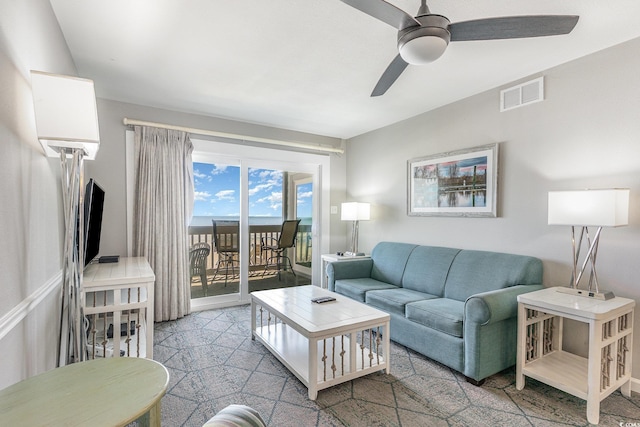 living area with a ceiling fan