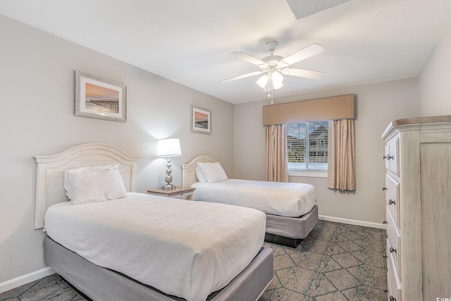 bedroom with baseboards and ceiling fan