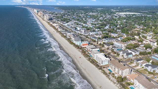 aerial view of property and surrounding area with unending shoreline