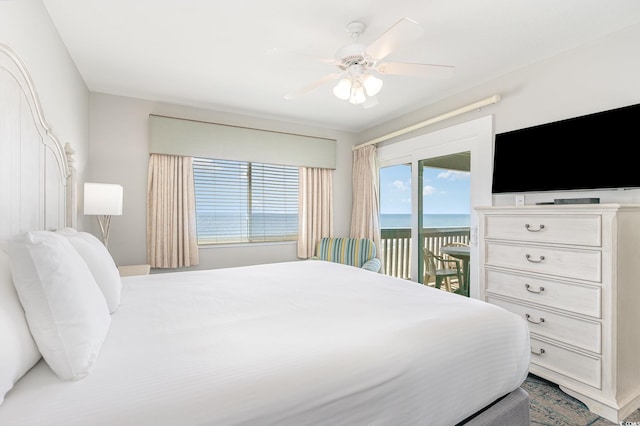 bedroom featuring access to exterior and a ceiling fan