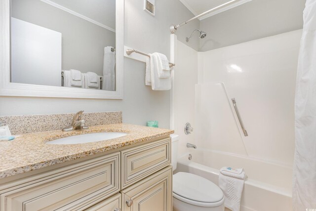 bathroom with shower / bath combo, toilet, vanity, and ornamental molding