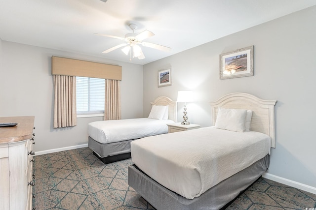 bedroom featuring baseboards and a ceiling fan