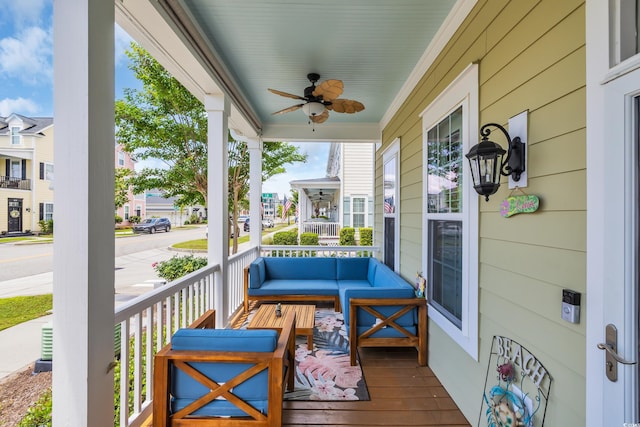 balcony with a porch, a ceiling fan, and an outdoor living space