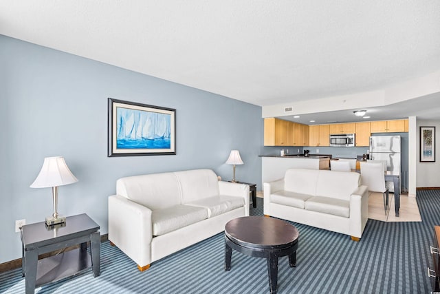107 S Ocean Blvd Unit 1402, Myrtle Beach, SC 29577 - living area with light carpet and baseboards