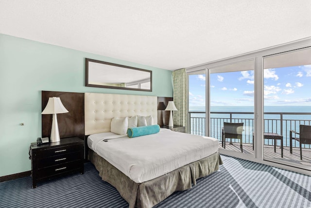 107 S Ocean Blvd Unit 1402, Myrtle Beach, SC 29577 - carpeted bedroom with access to exterior, a water view, floor to ceiling windows, and a textured ceiling
