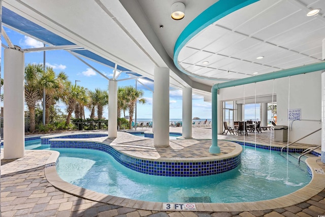 107 S Ocean Blvd Unit 1402, Myrtle Beach, SC 29577 - indoor pool featuring a hot tub and a patio area