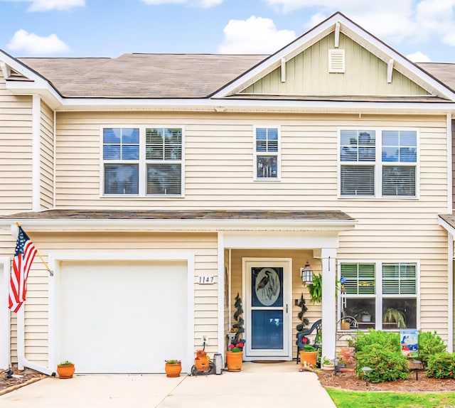 1147 Fairway Ln Unit 1147, Conway, SC 29526 - townhome / multi-family property featuring driveway, a garage, roof with shingles, and board and batten siding