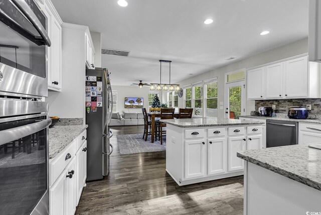 6239 Chadderton Cir, Myrtle Beach, SC 29579 - kitchen featuring stainless steel appliances, white cabinetry, recessed lighting, ceiling fan, and dark wood finished floors