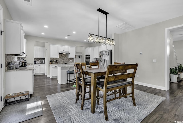 6239 Chadderton Cir, Myrtle Beach, SC 29579 - dining room featuring dark wood-style flooring, recessed lighting, and baseboards