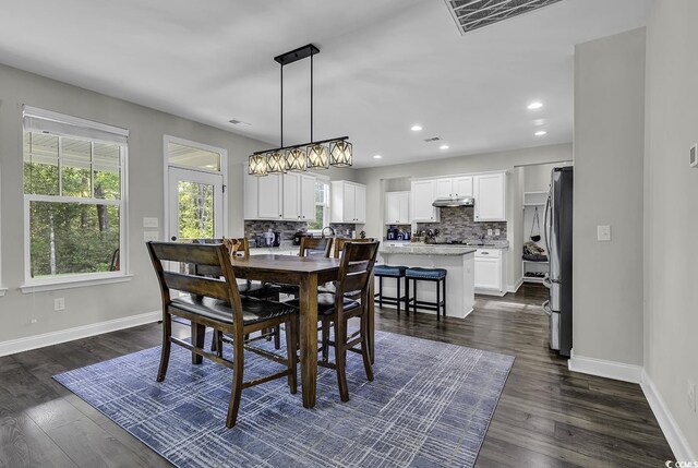 6239 Chadderton Cir, Myrtle Beach, SC 29579 - dining area featuring baseboards, dark wood-style flooring, and recessed lighting
