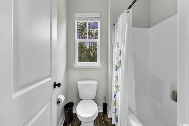 6239 Chadderton Cir, Myrtle Beach, SC 29579 - bathroom featuring wood finished floors, baseboards, toilet, and shower / bath combo