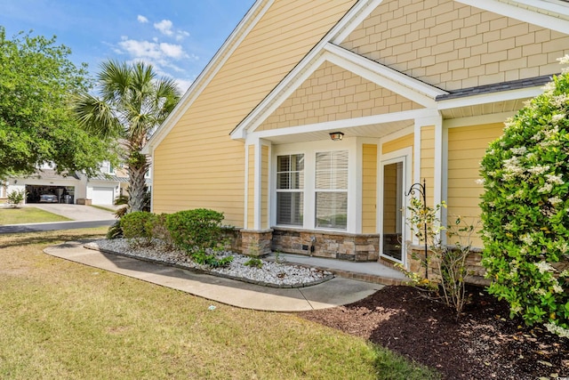 view of home's exterior featuring a yard