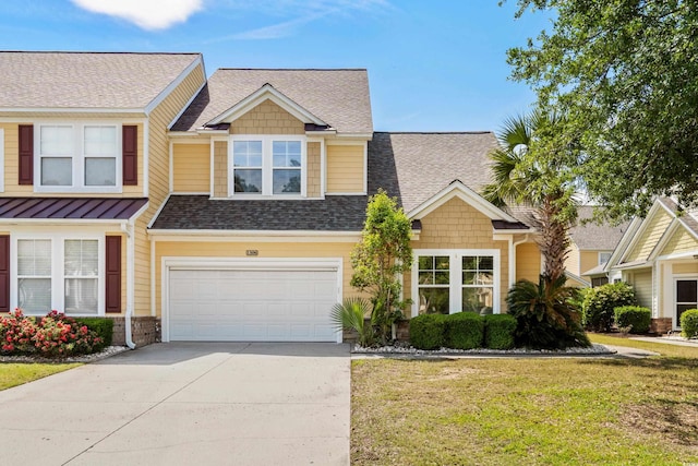 view of front of property with concrete driveway, a garage, a shingled roof, and a front lawn
