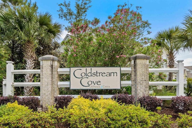 community sign with fence