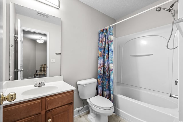 full bath with a textured ceiling, tile patterned flooring, toilet, shower / bath combo, and vanity