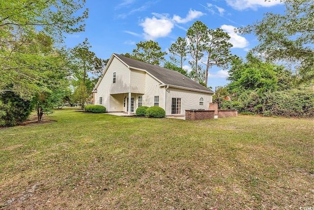 1729 Longleaf Dr, Myrtle Beach, SC 29575 - view of side of home featuring a patio area and a lawn